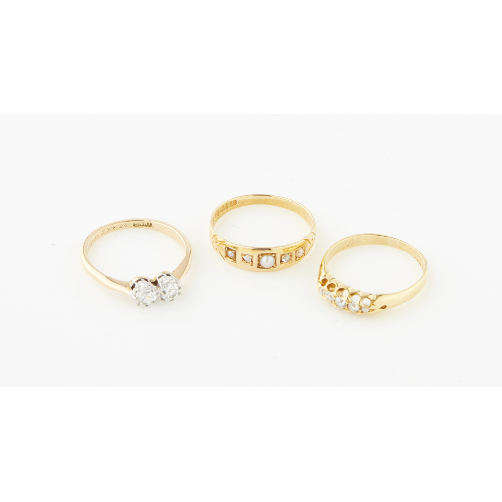A collection of three diamond set rings