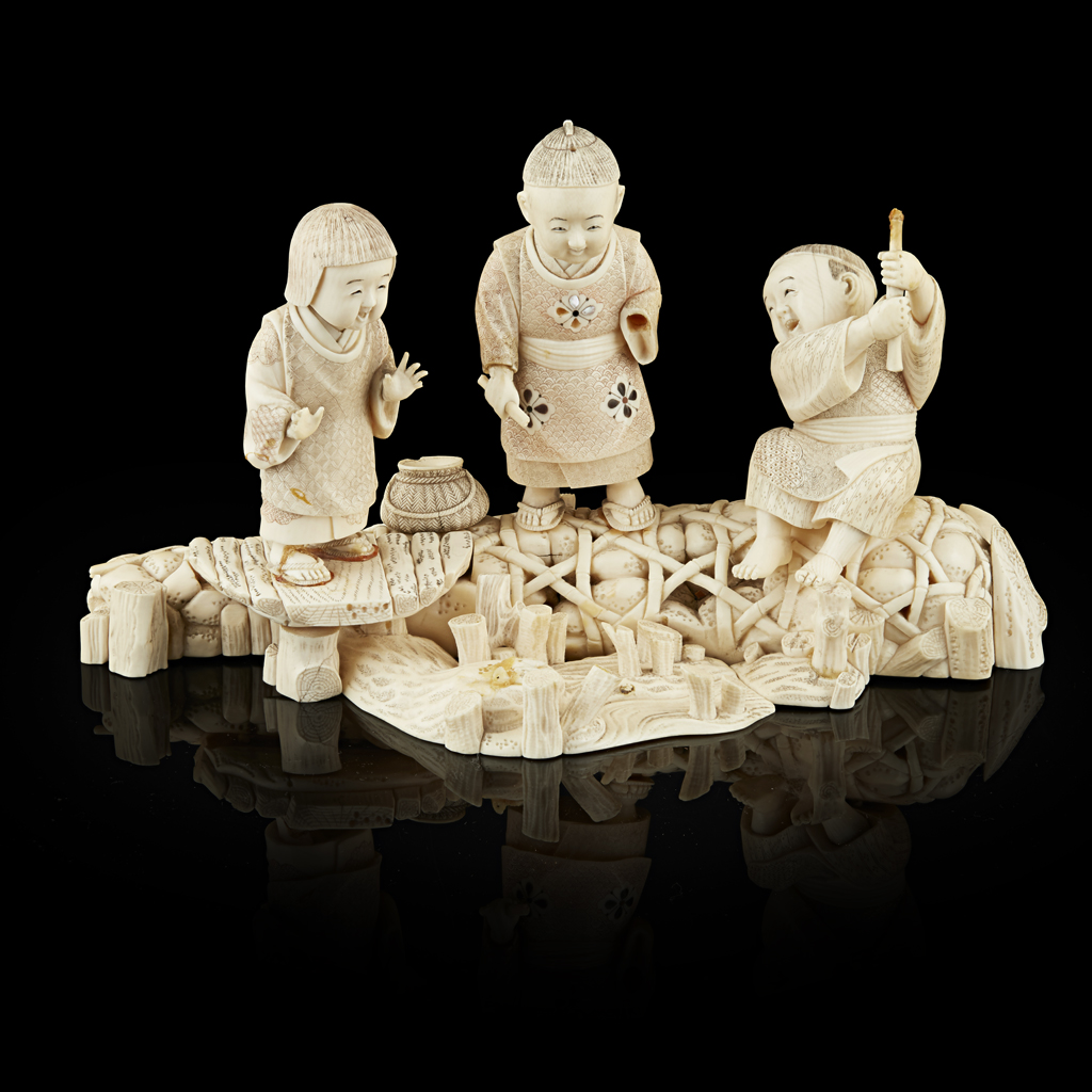 IVORY OKIMONO DEPICTING CHILDREN AT PLAY