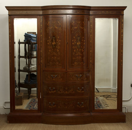 An Edwardian mahogany and marquetry bowfront wardrobe