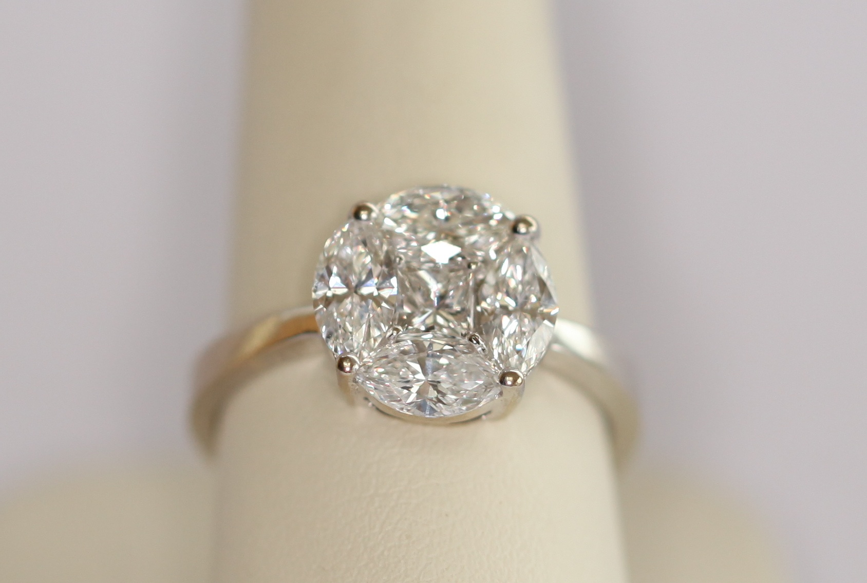 An 18ct white gold mounted diamond cluster ring