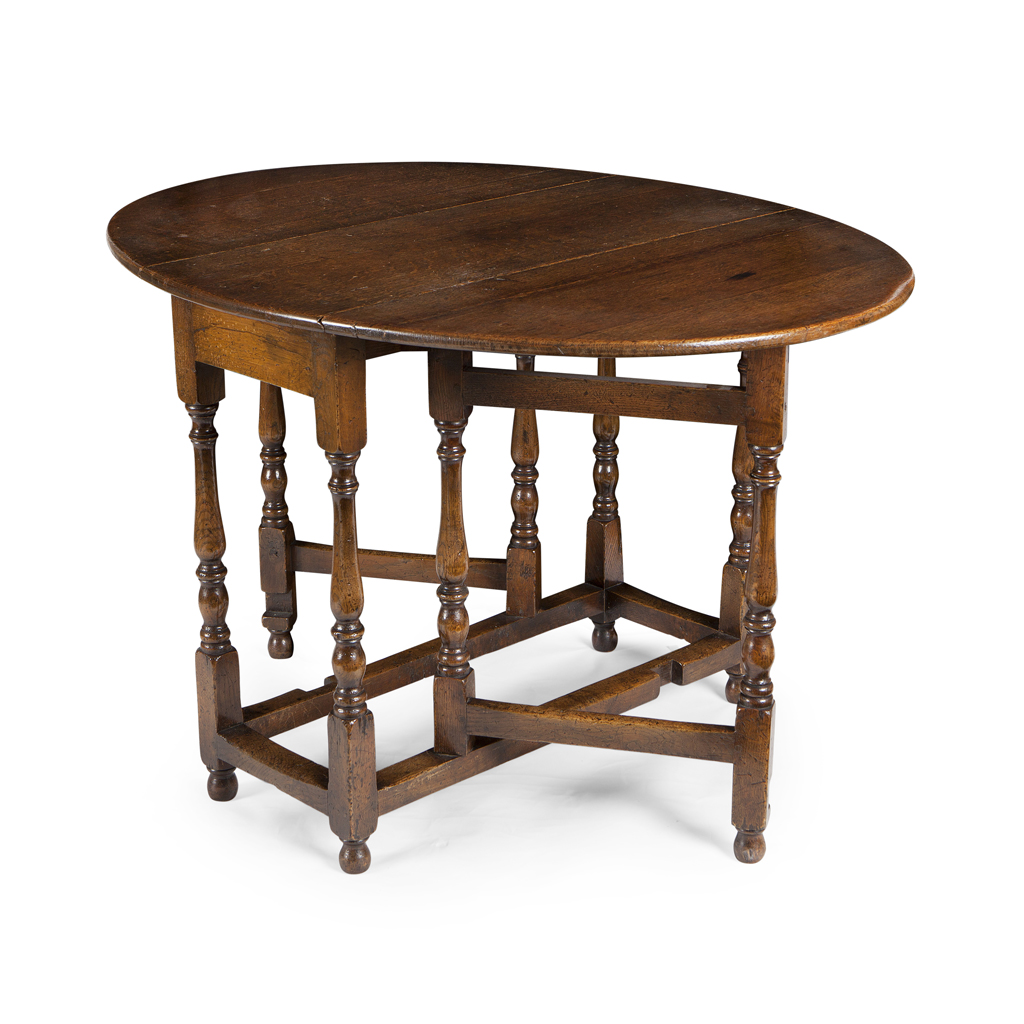 A GEORGE III OAK GATE LEG TABLE