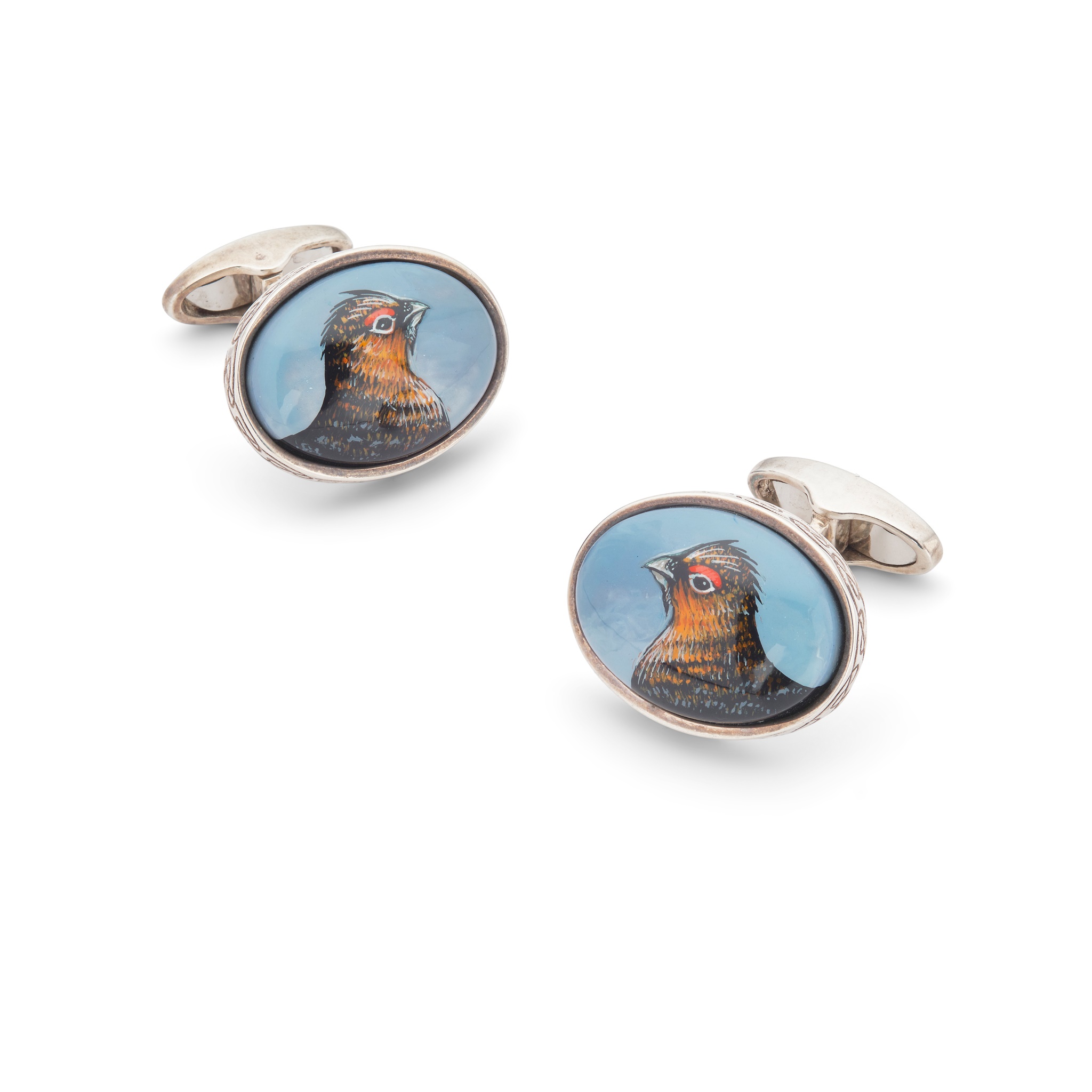 A pair of silver and enamel 'grouse' cufflinks