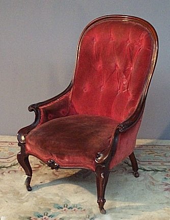 A Victorian mahogany open armchair