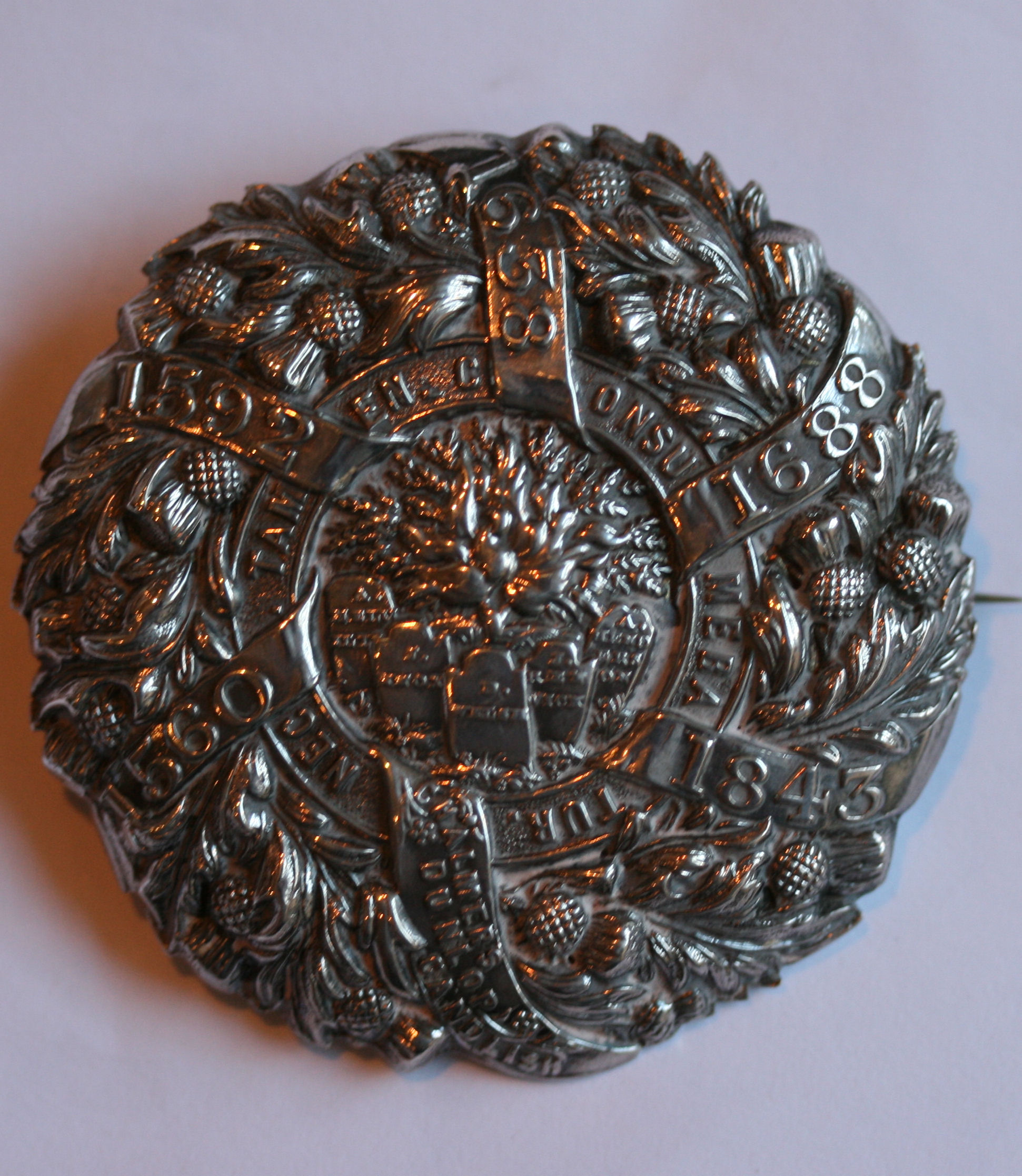 A Disruption brooch