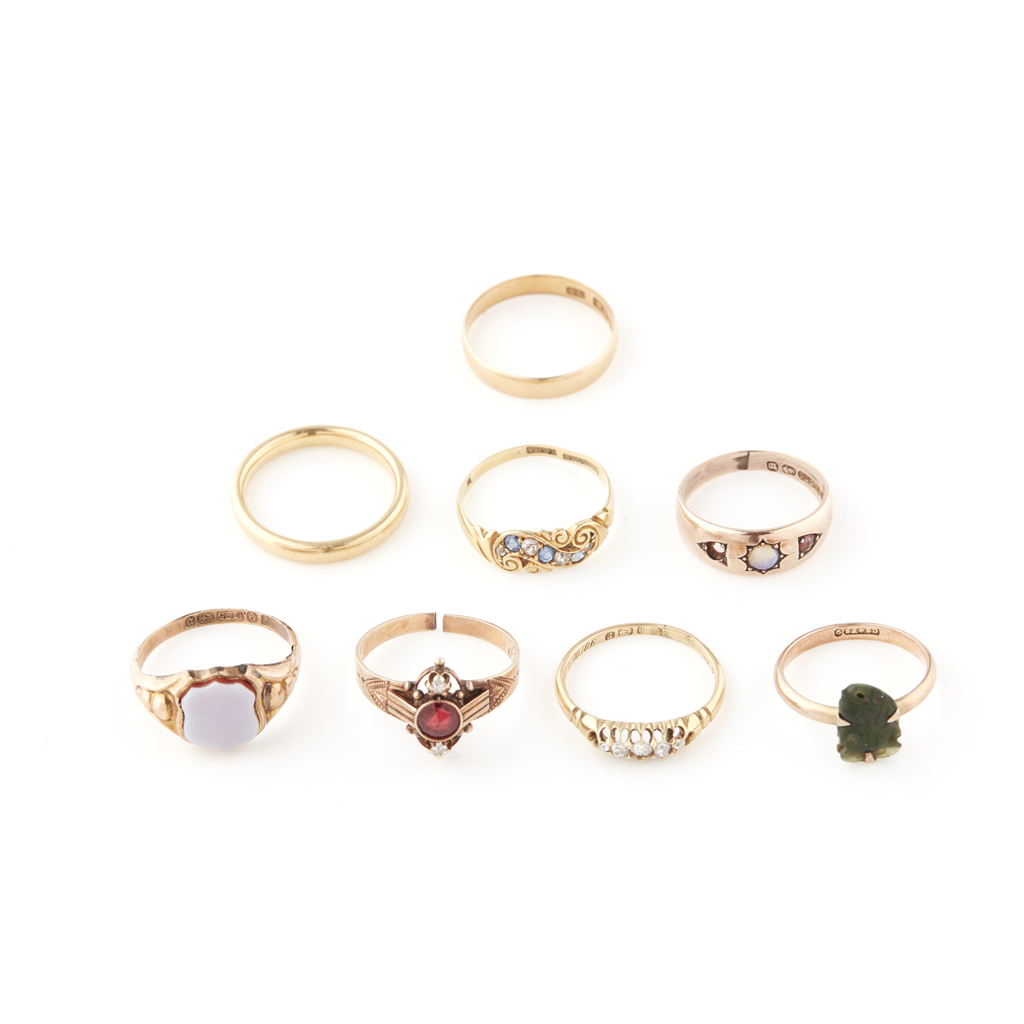 A collection of gold and gem set rings