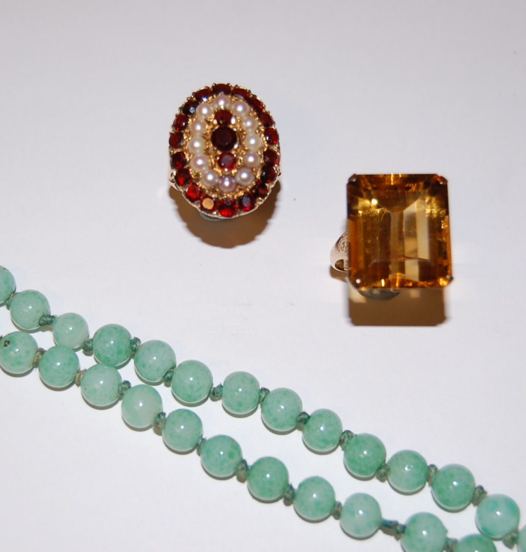 A large garnet and pearl set cocktail ring