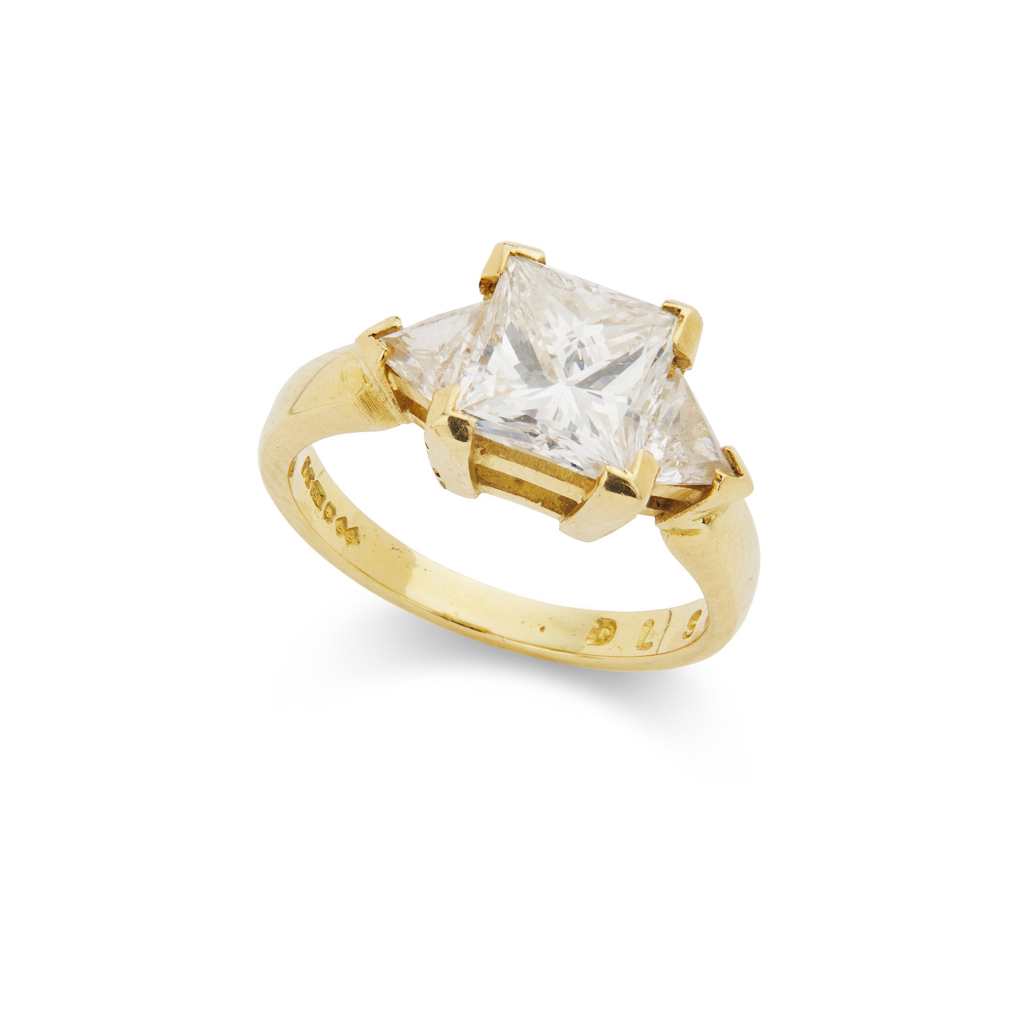 A gold and diamond three-stone ring