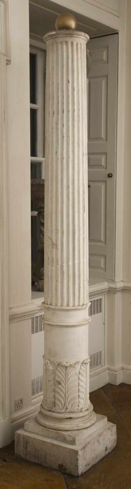 A pair of large white marble columns