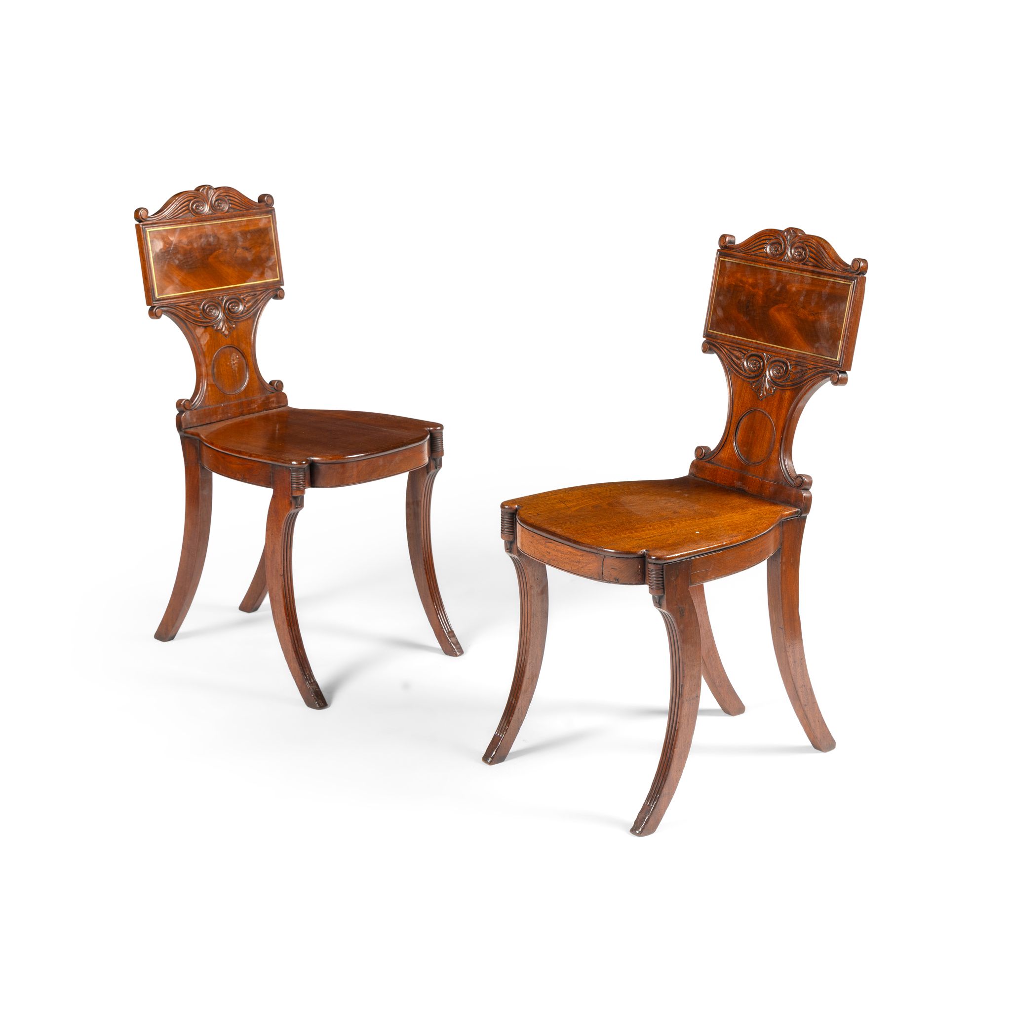 A PAIR OF REGENCY MAHOGANY HALL CHAIRS