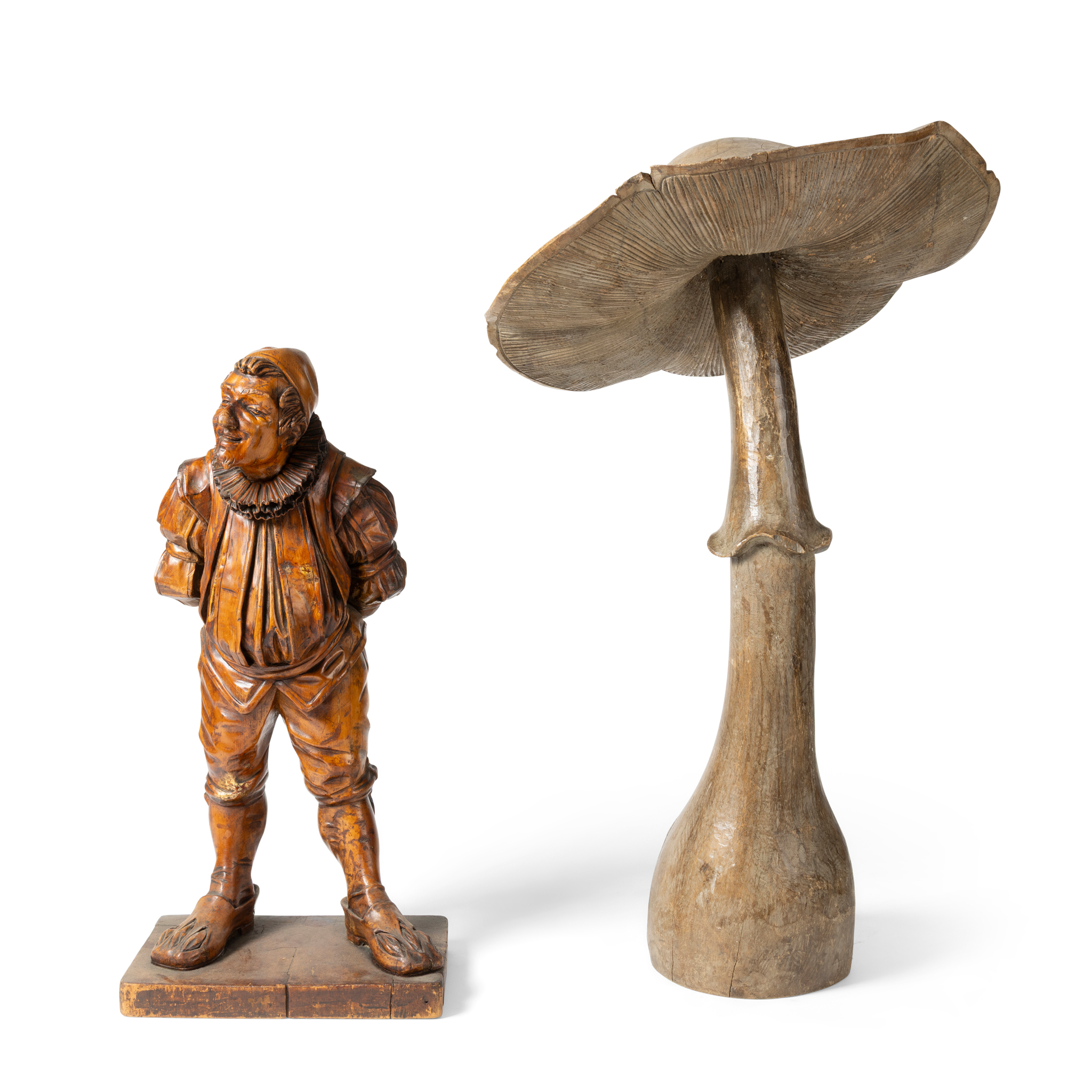 A CONTINENTAL BEECH CARVED FIGURE OF JOLLY GENTLEMAN IN IN 16TH CENTURY COSTUME
