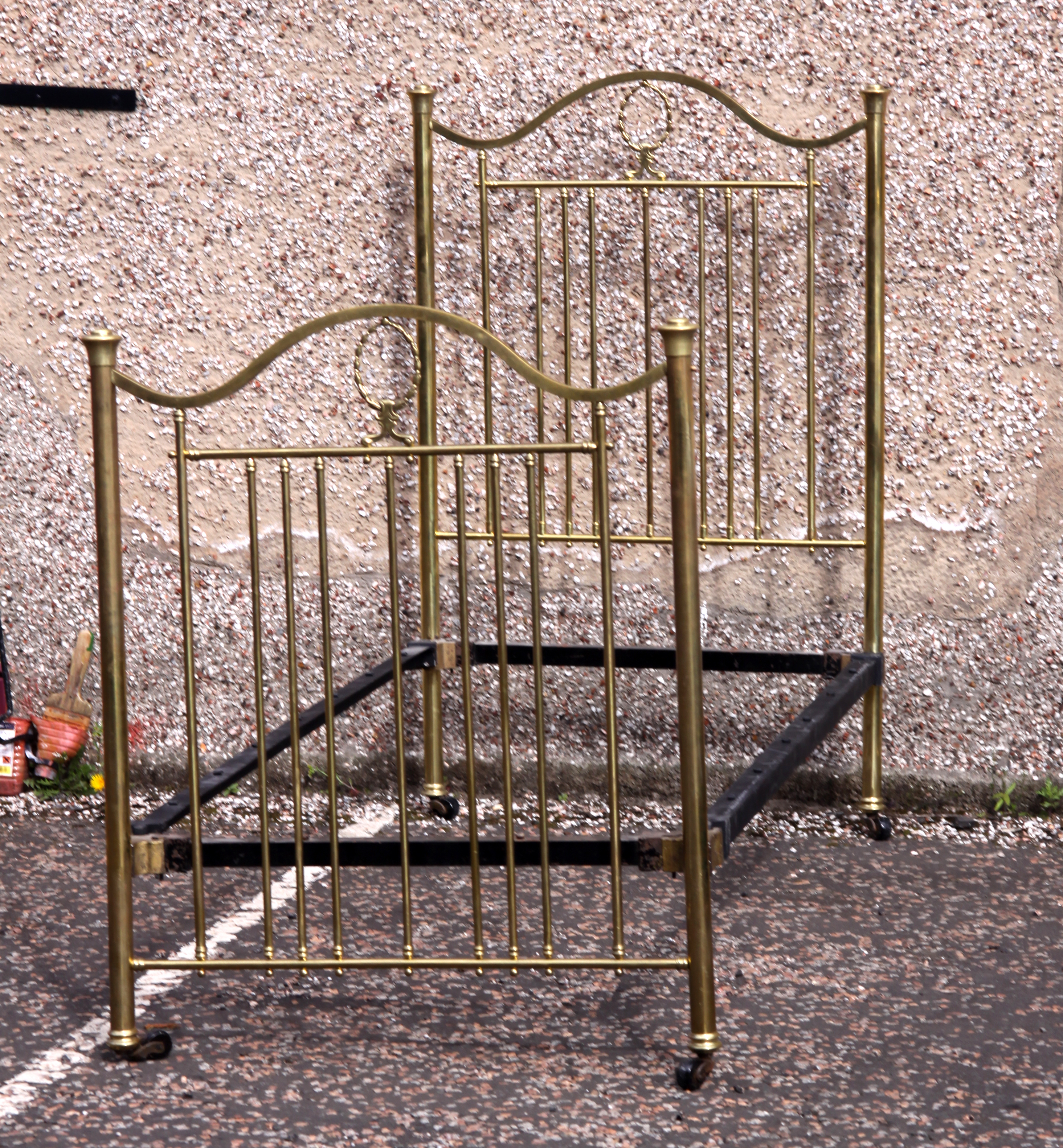 A pair of brass single beds