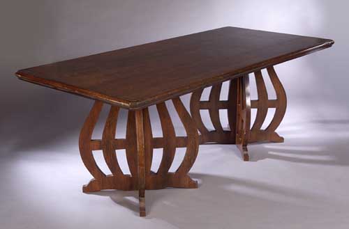 An Art Nouveau stained oak refectory table