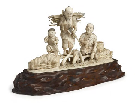 A Japanese ivory figure group,
