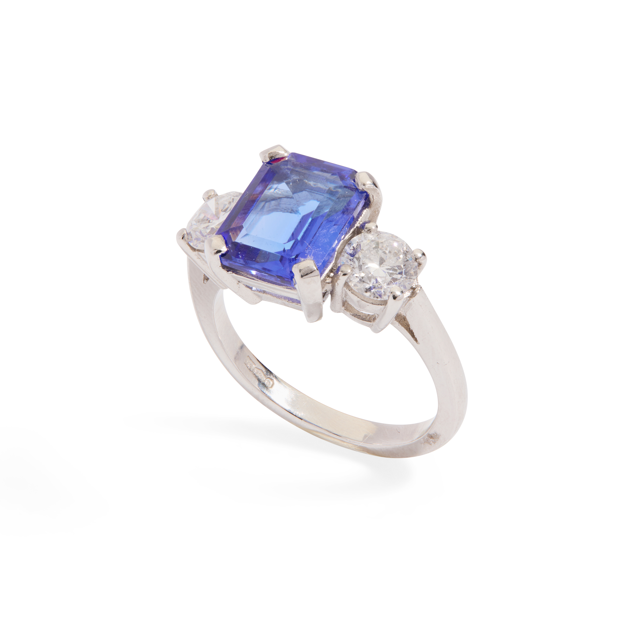 A platinum Tanzanite and diamond three-stone ring