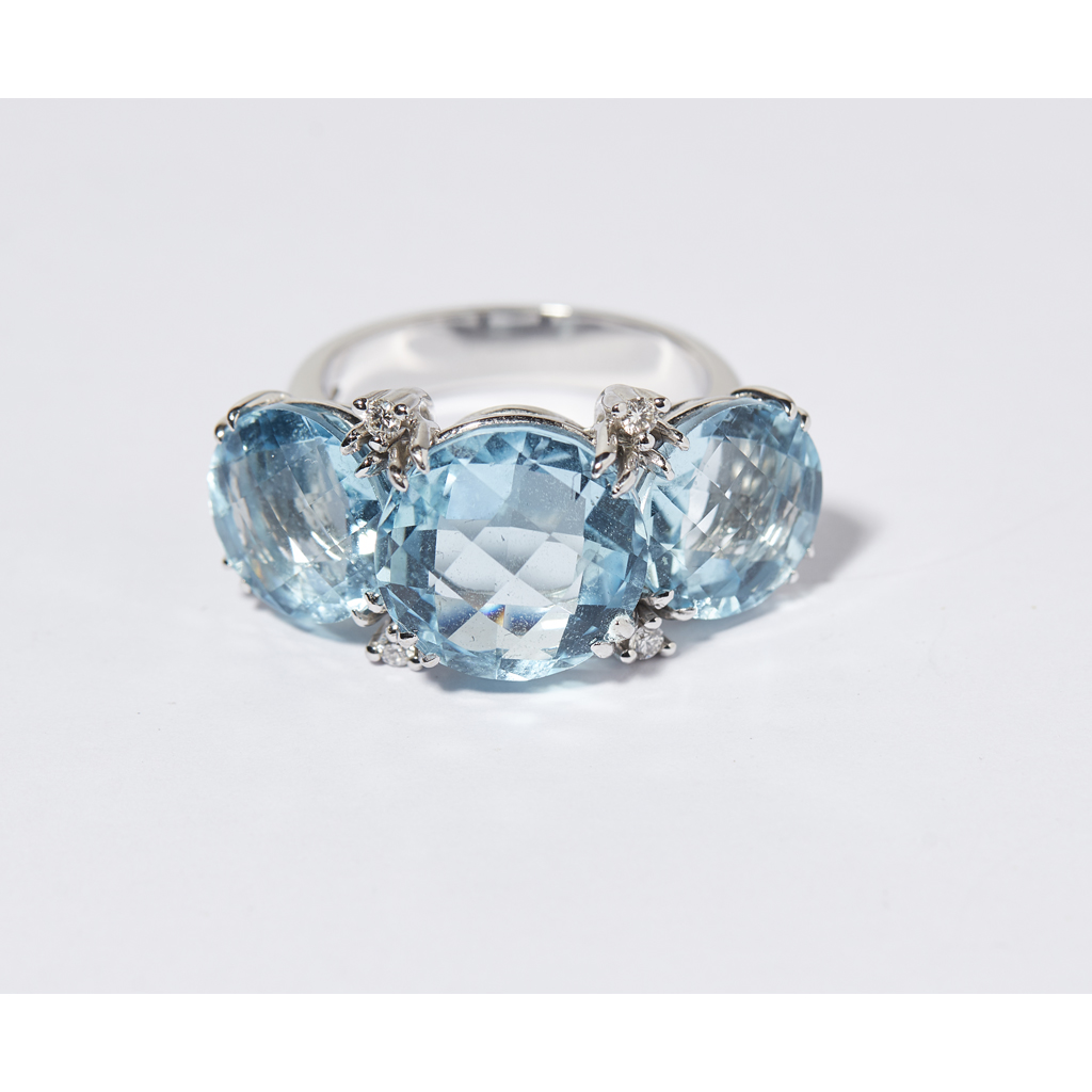 A large aquamarine and diamond set dress ring