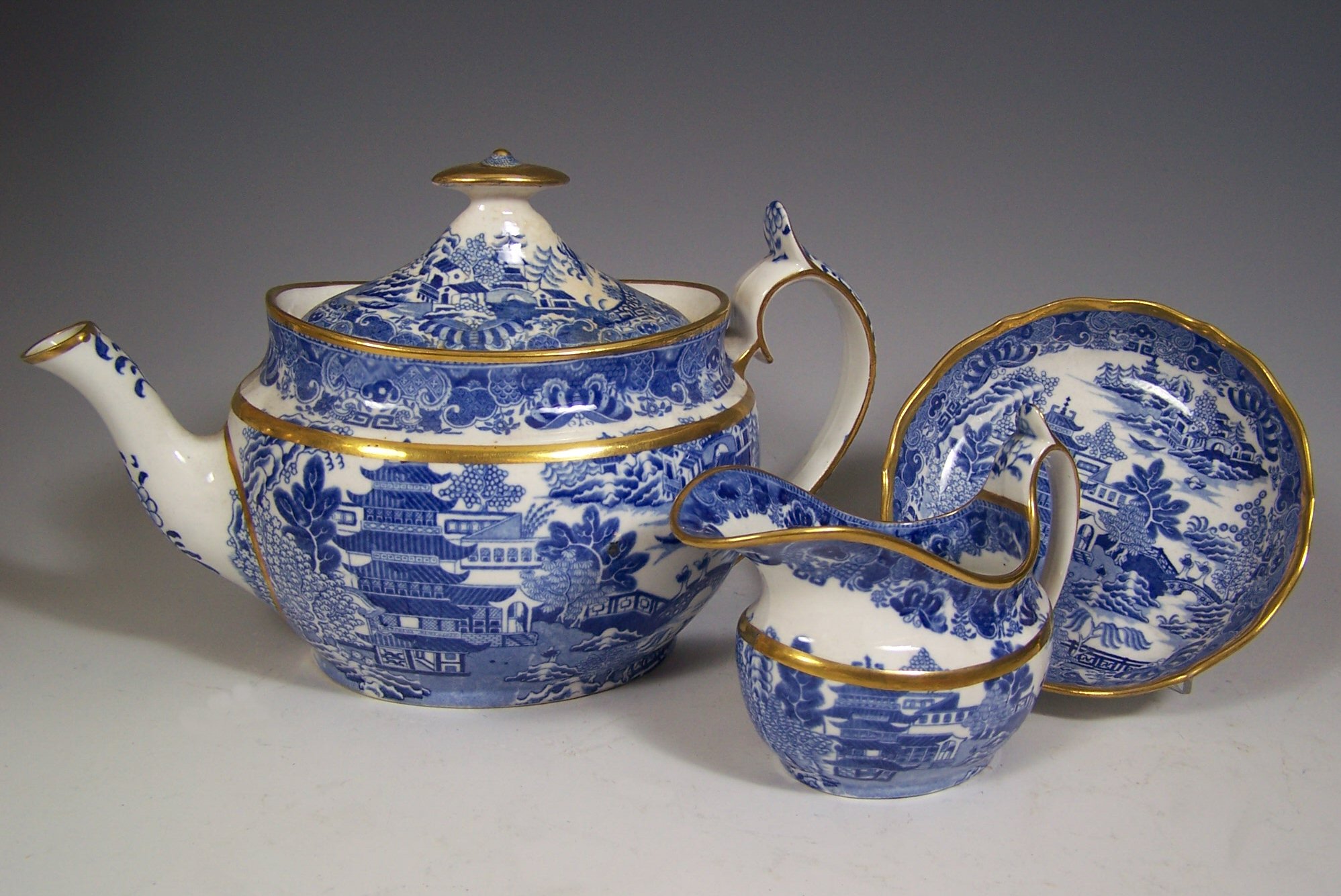 A 19th century English blue printed part tea set