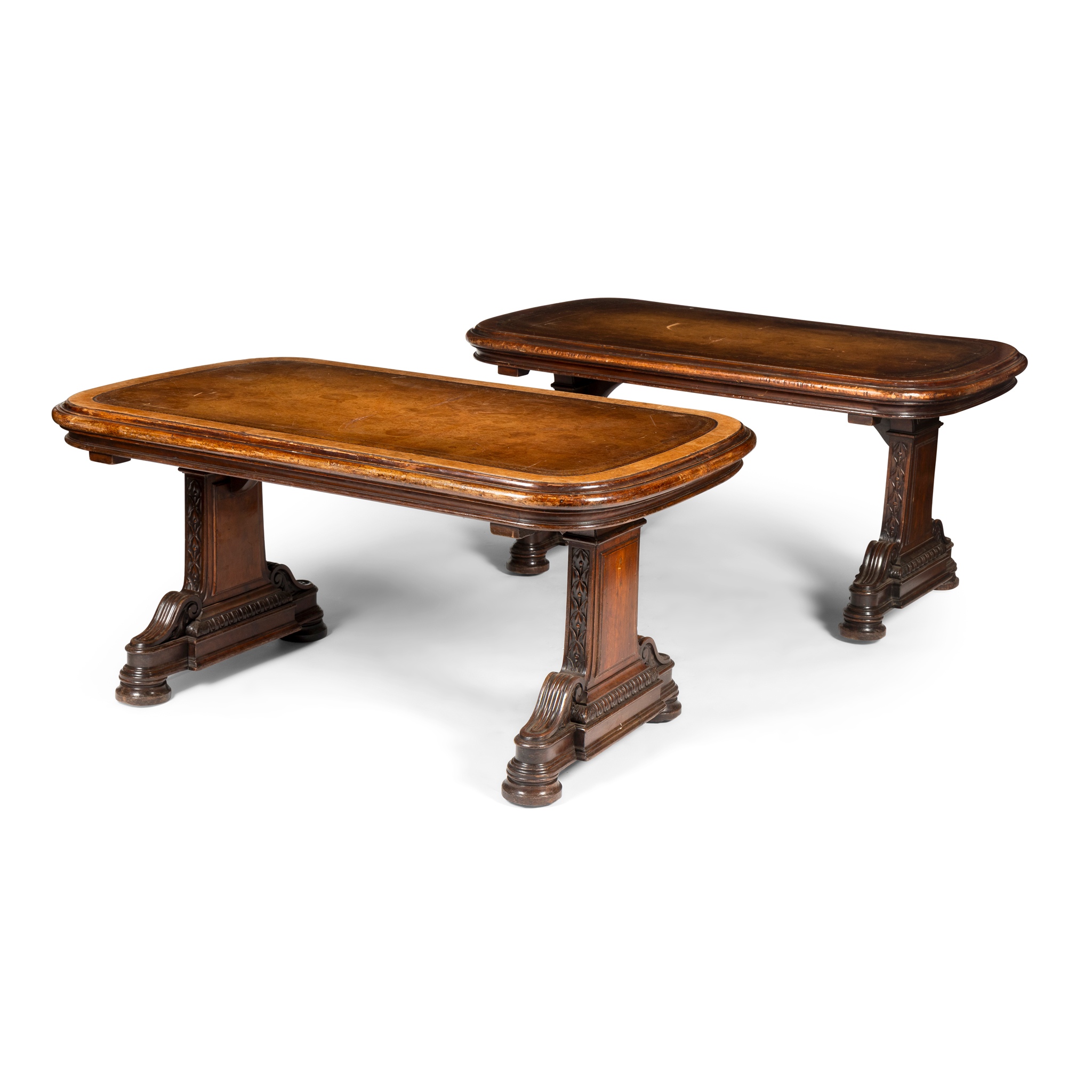 A PAIR OF WALNUT AND LEATHER INSET LIBRARY TABLES