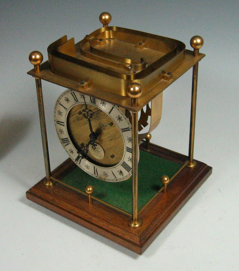 A brass moving ball clock by Thwaites and Reed Ltd. Hastings