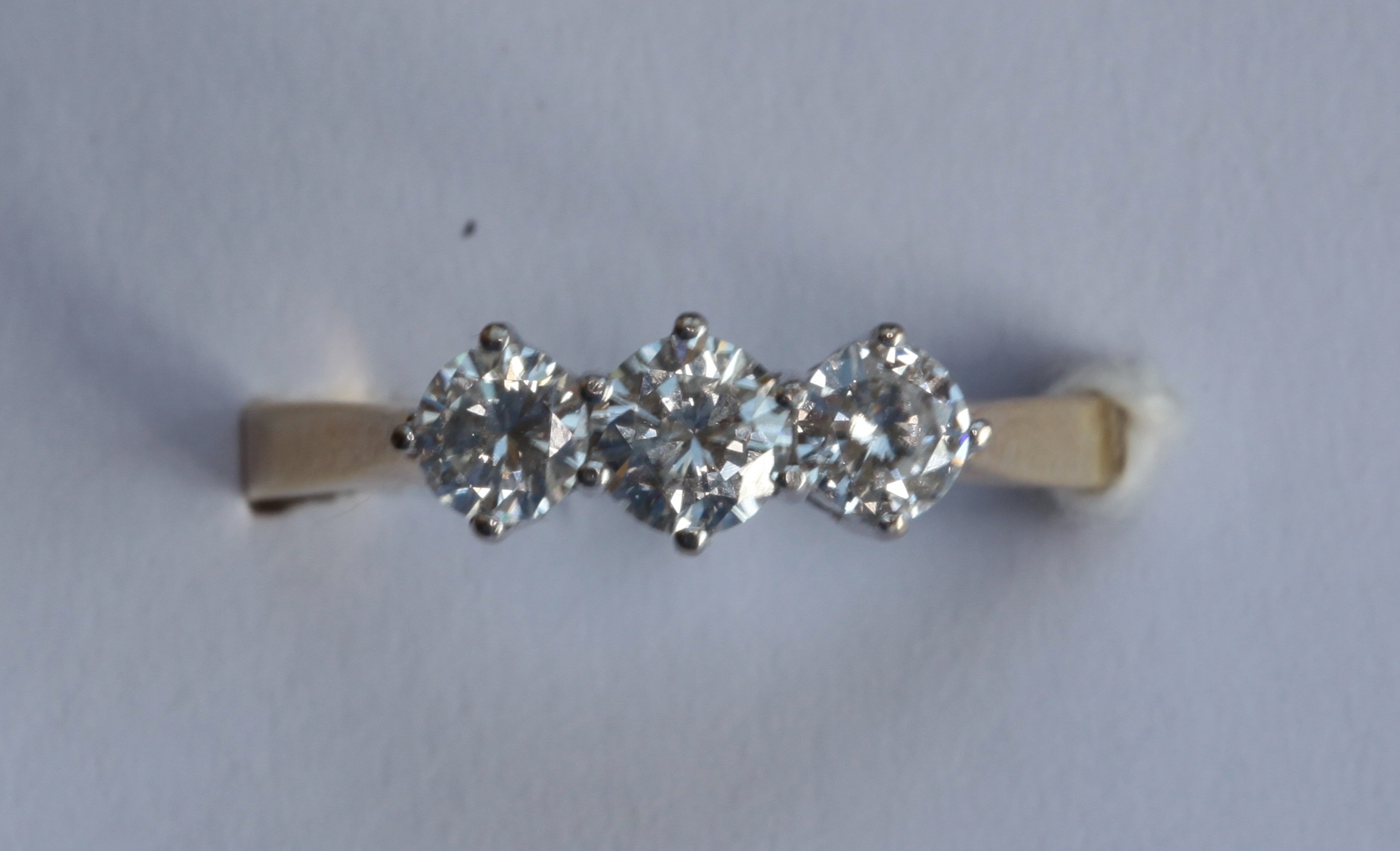 An 18ct yellow gold mounted diamond set three-stone ring