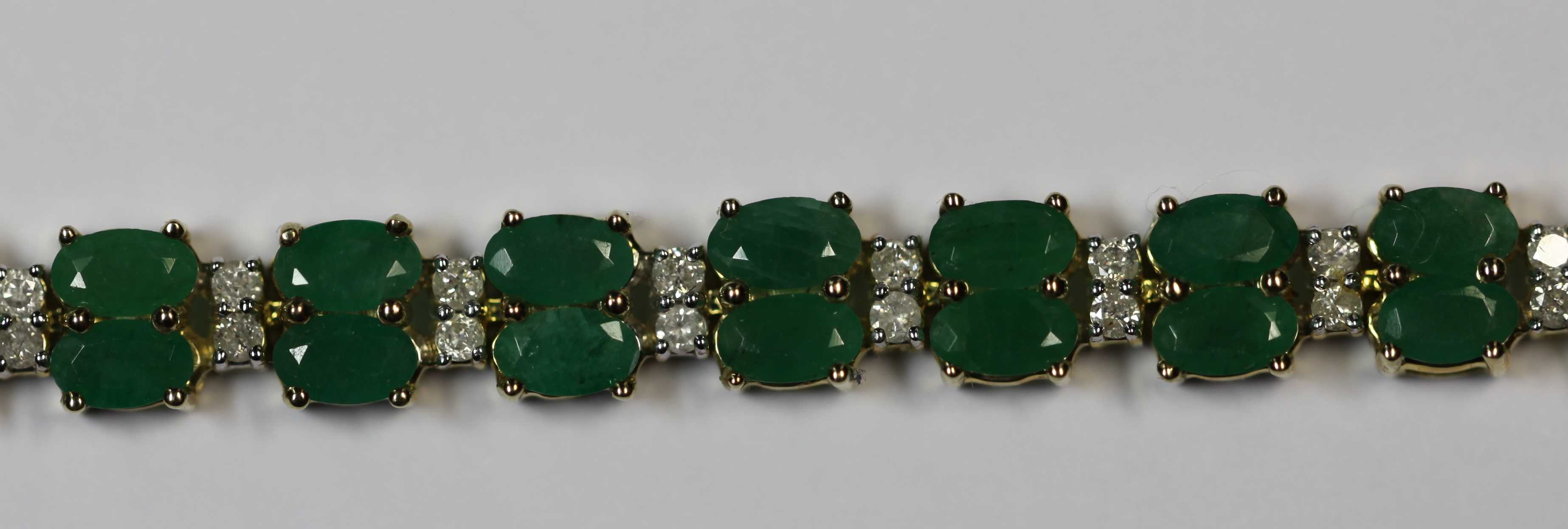 A diamond and emerald bracelet