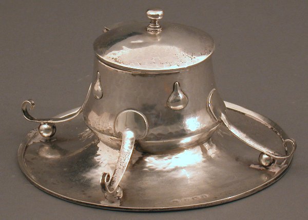 An Arts and Crafts silver inkwell by A.E. Jones