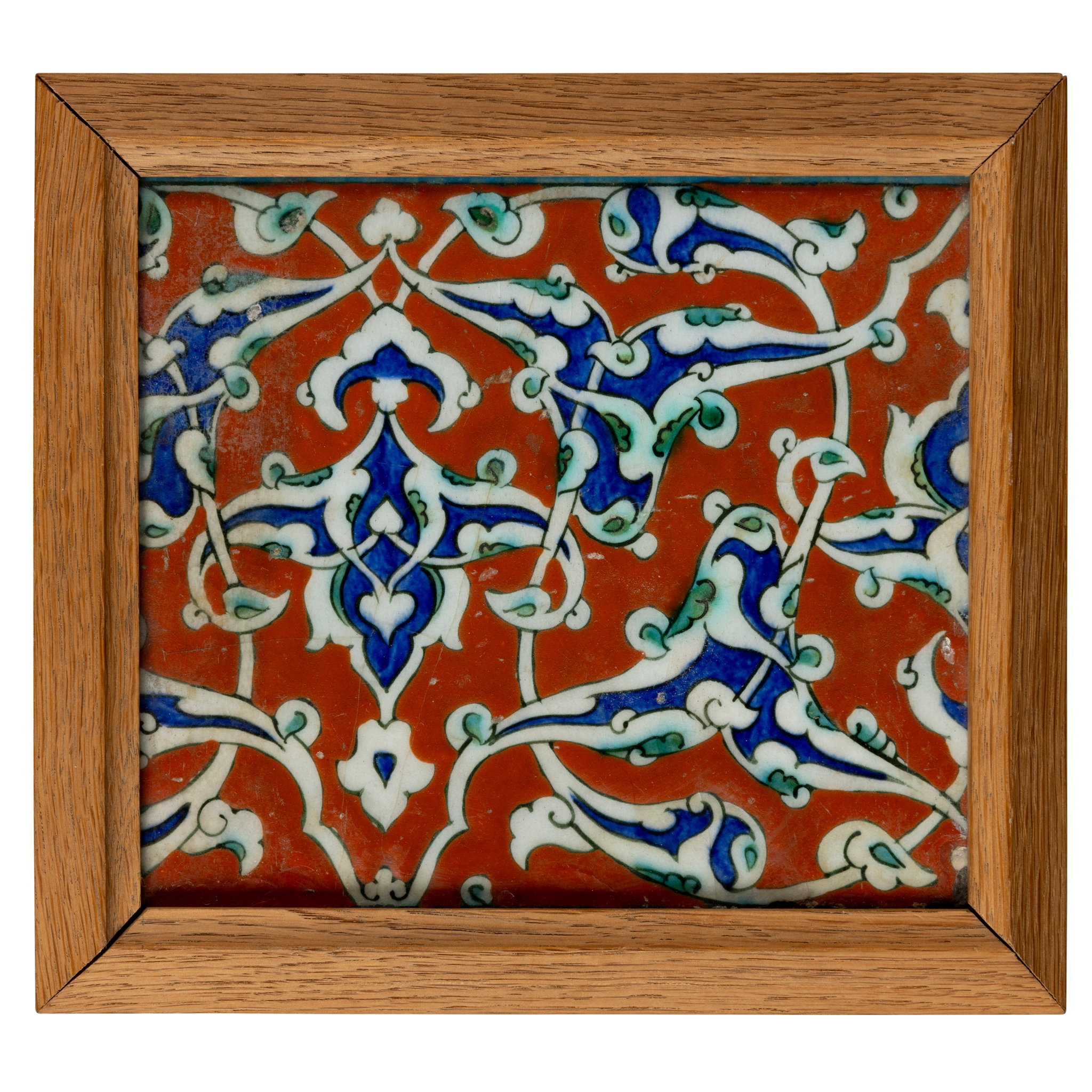 AN INTACT IZNIK POTTERY BORDER TILE