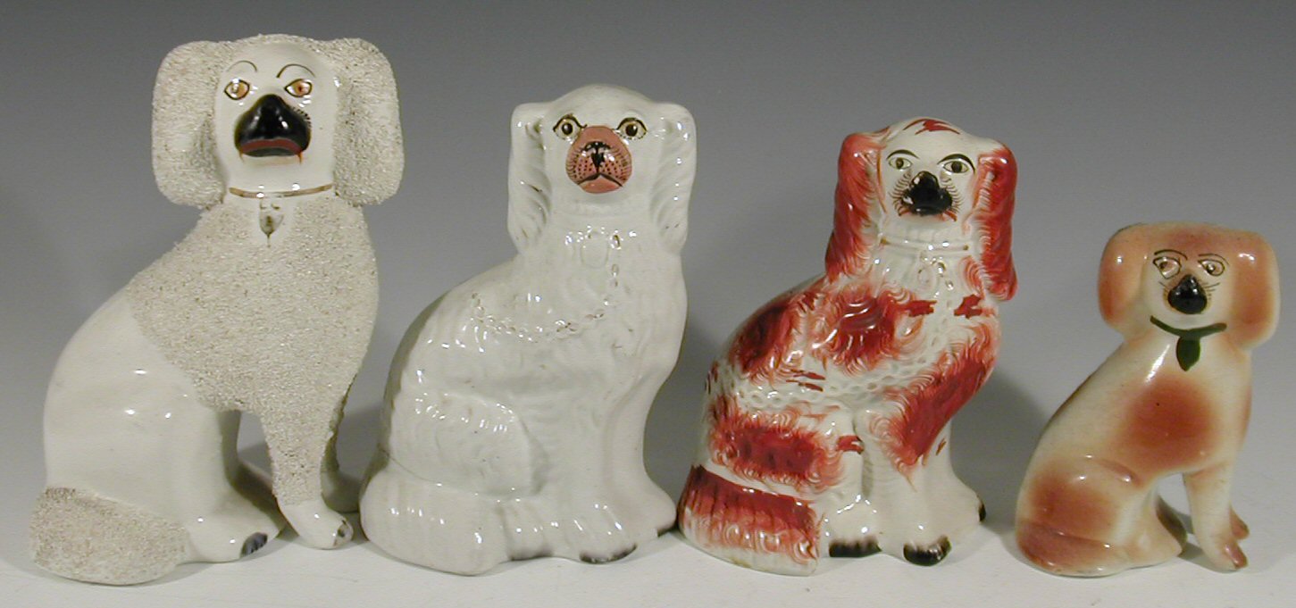 Eight various pairs of 19th century Staffordshire seated spaniel figures (16)