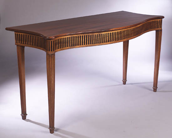 A George III mahogany serpentine serving table,