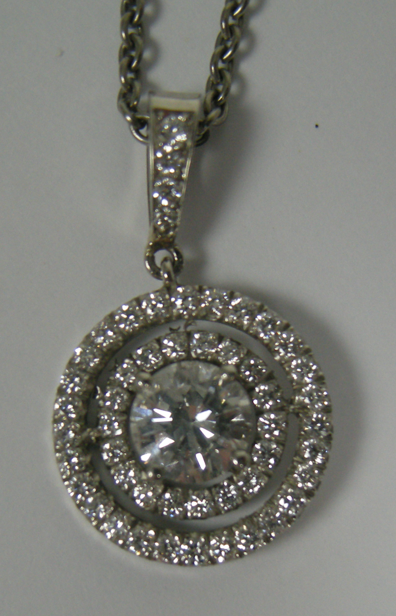 A diamond set pendant with chain