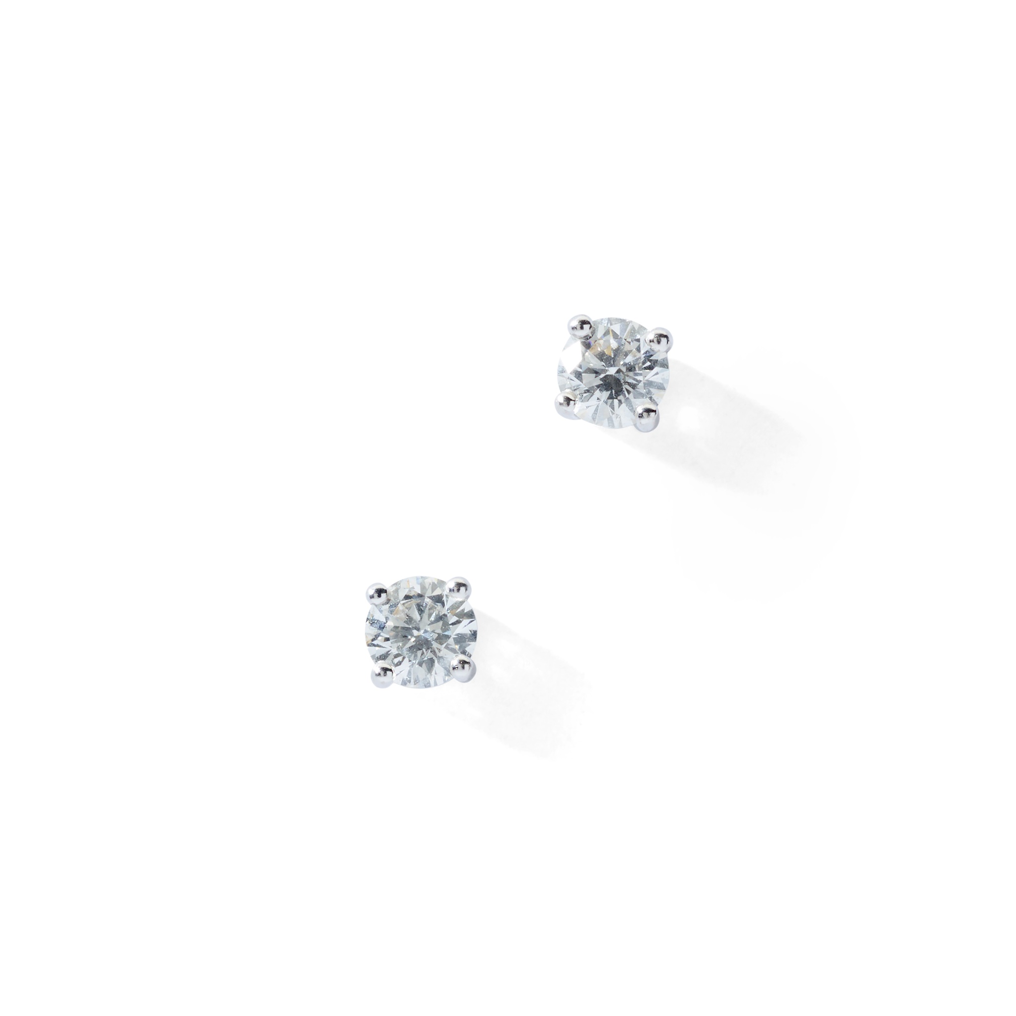 A pair of diamond stud earrings