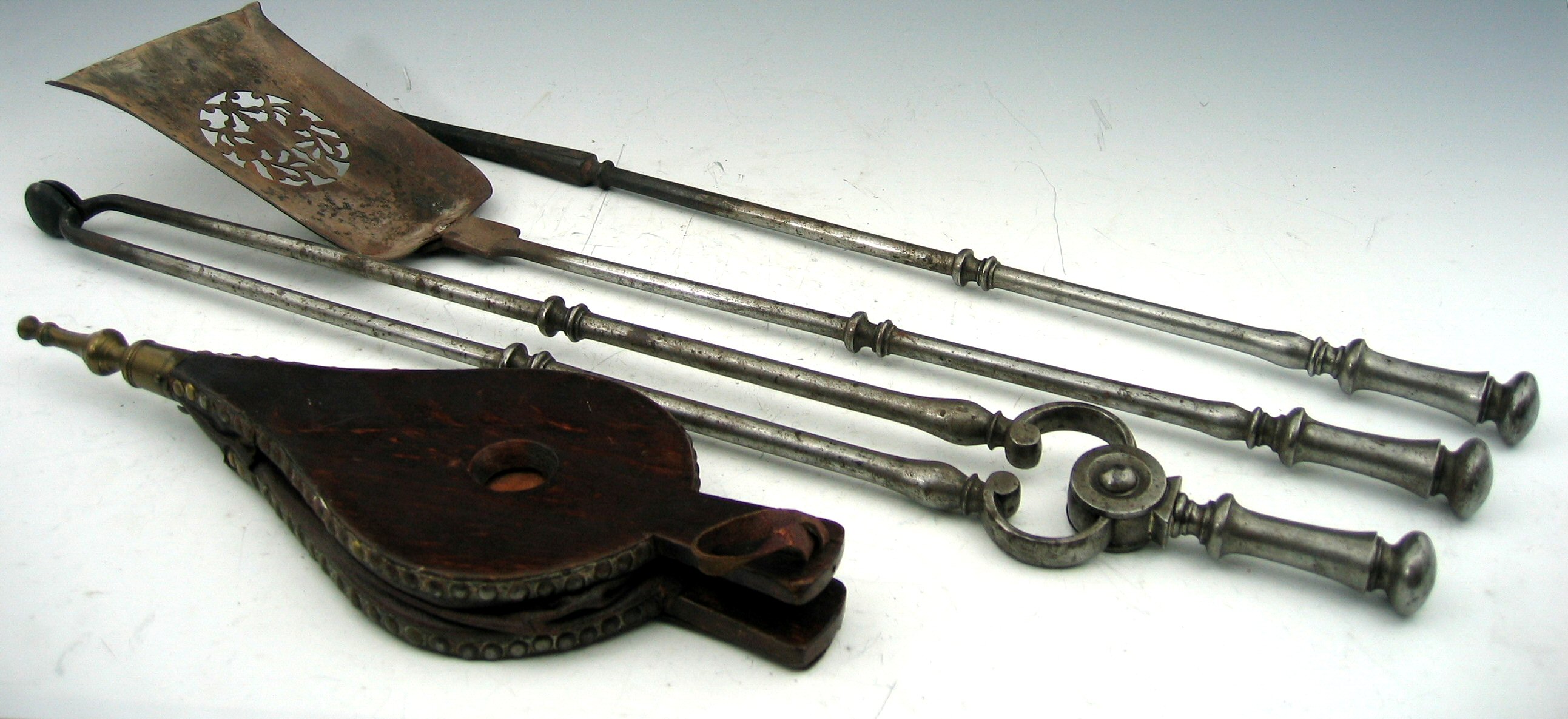 A set of three early 19th century steel fire irons,