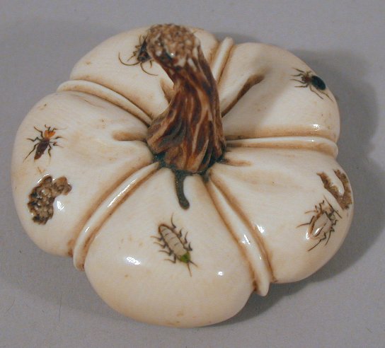 A Japanese carved ivory shibyama decorated flattened gourd
