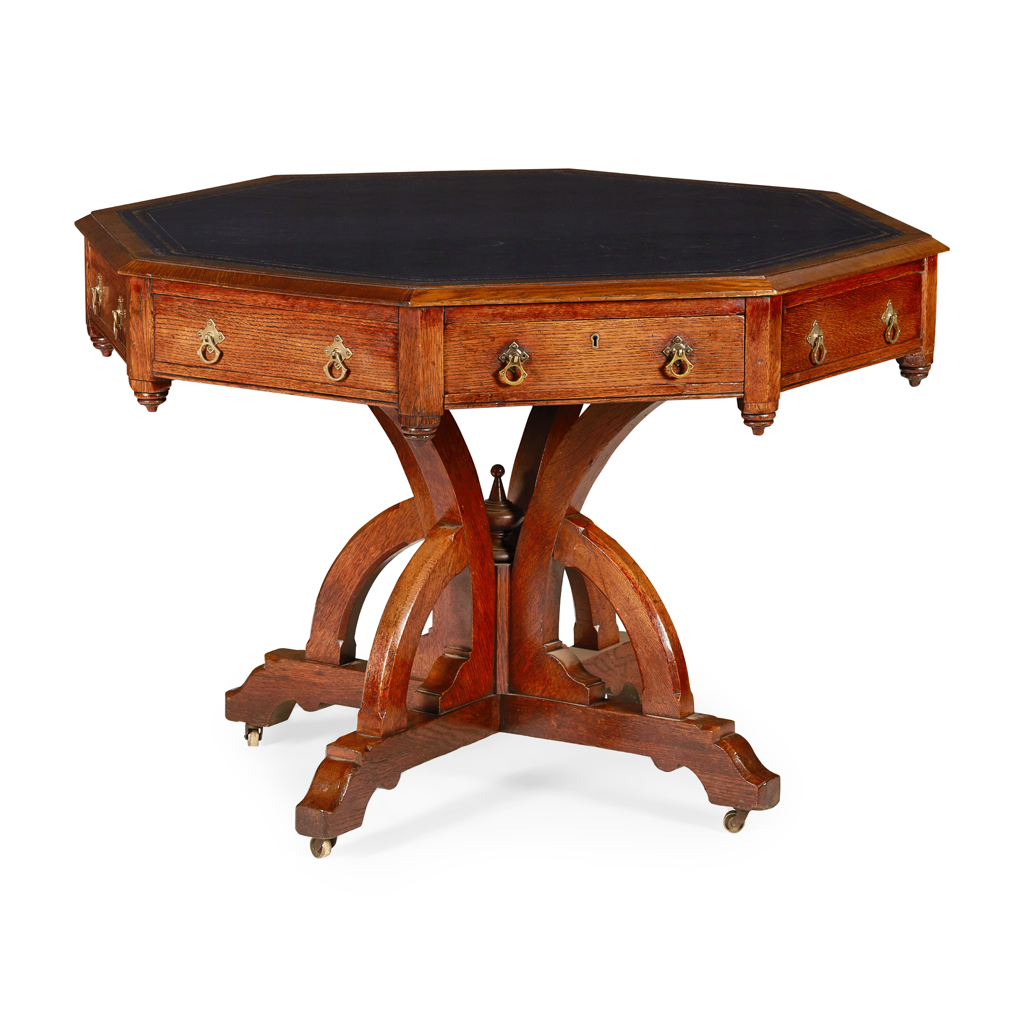 WILLIAM IV GOTHIC REVIVAL OAK LIBRARY DRUM TABLE IN THE MANNER OF A W PUGIN