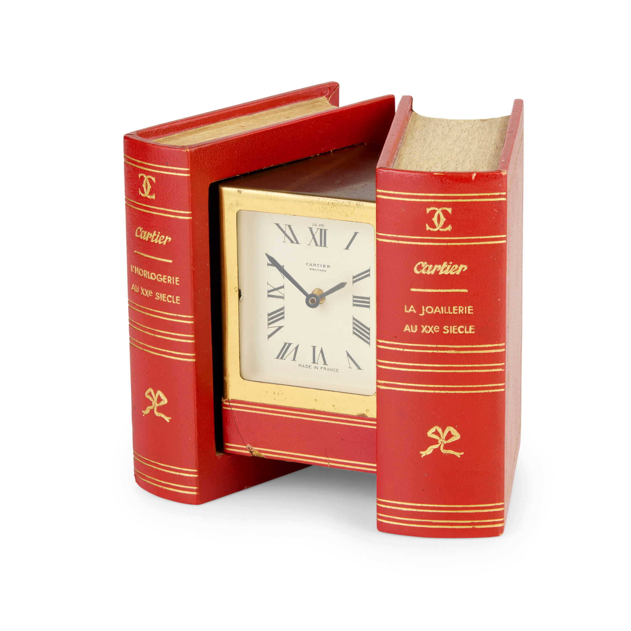 Cartier, France. An unusual gilt metal electronic clock in the form of a book