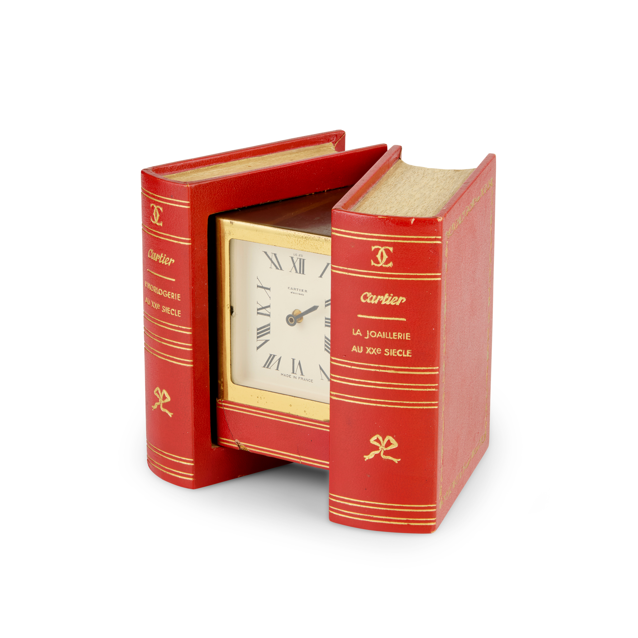 Cartier, France. An unusual gilt metal electronic clock in the form of a book