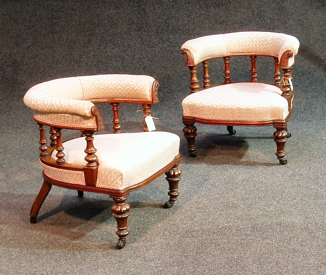 A pair of Edwardian mahogany tub chairs,
