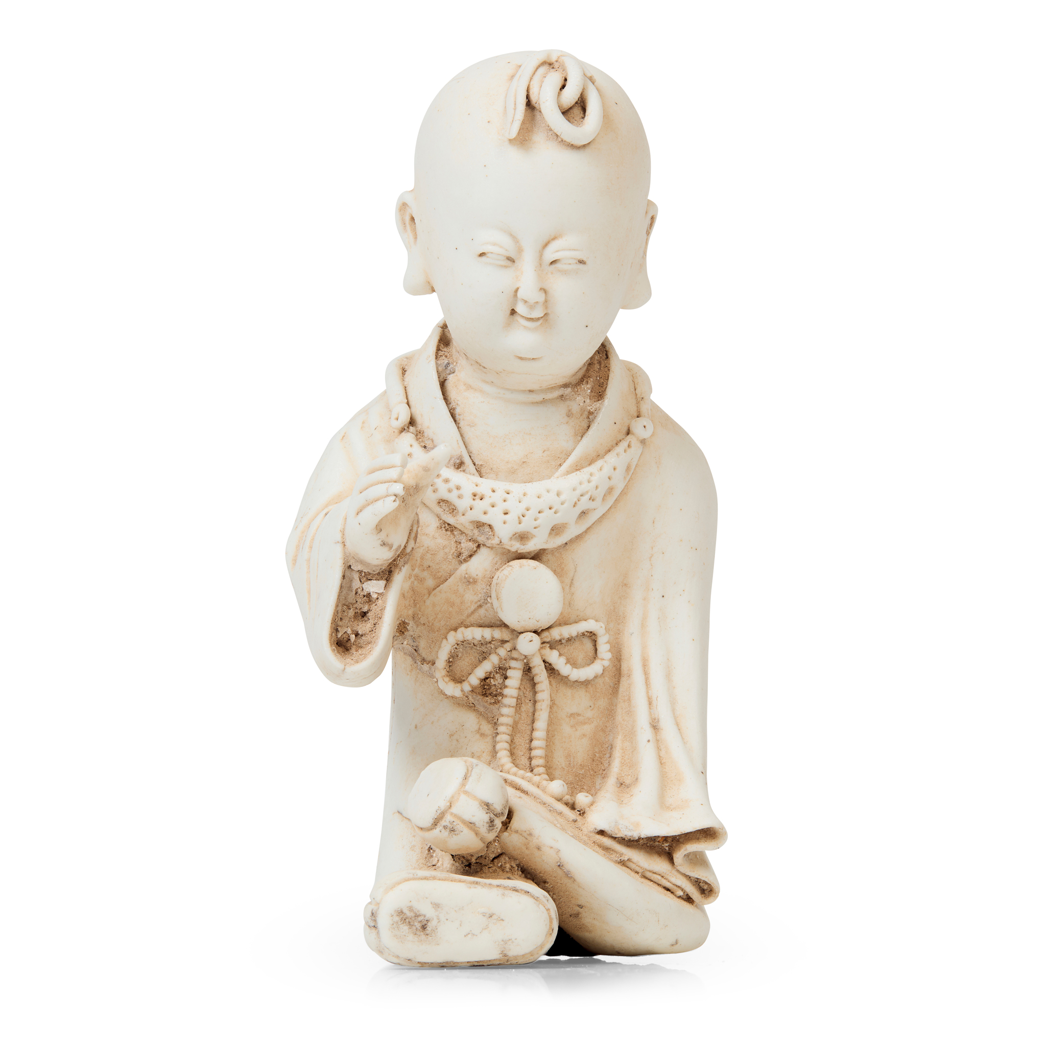 BISCUIT PORCELAIN FIGURE OF A SEATED BOY