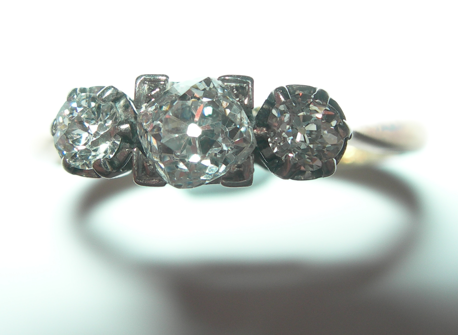 An 18ct gold and platinum mounted diamond three-stone ring,