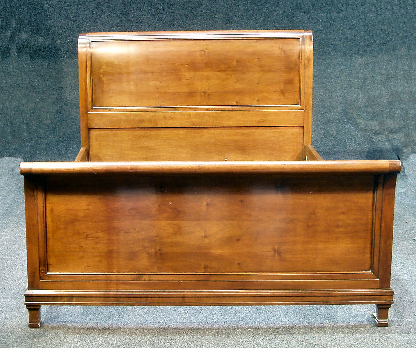 A mahogany king size sleigh bed