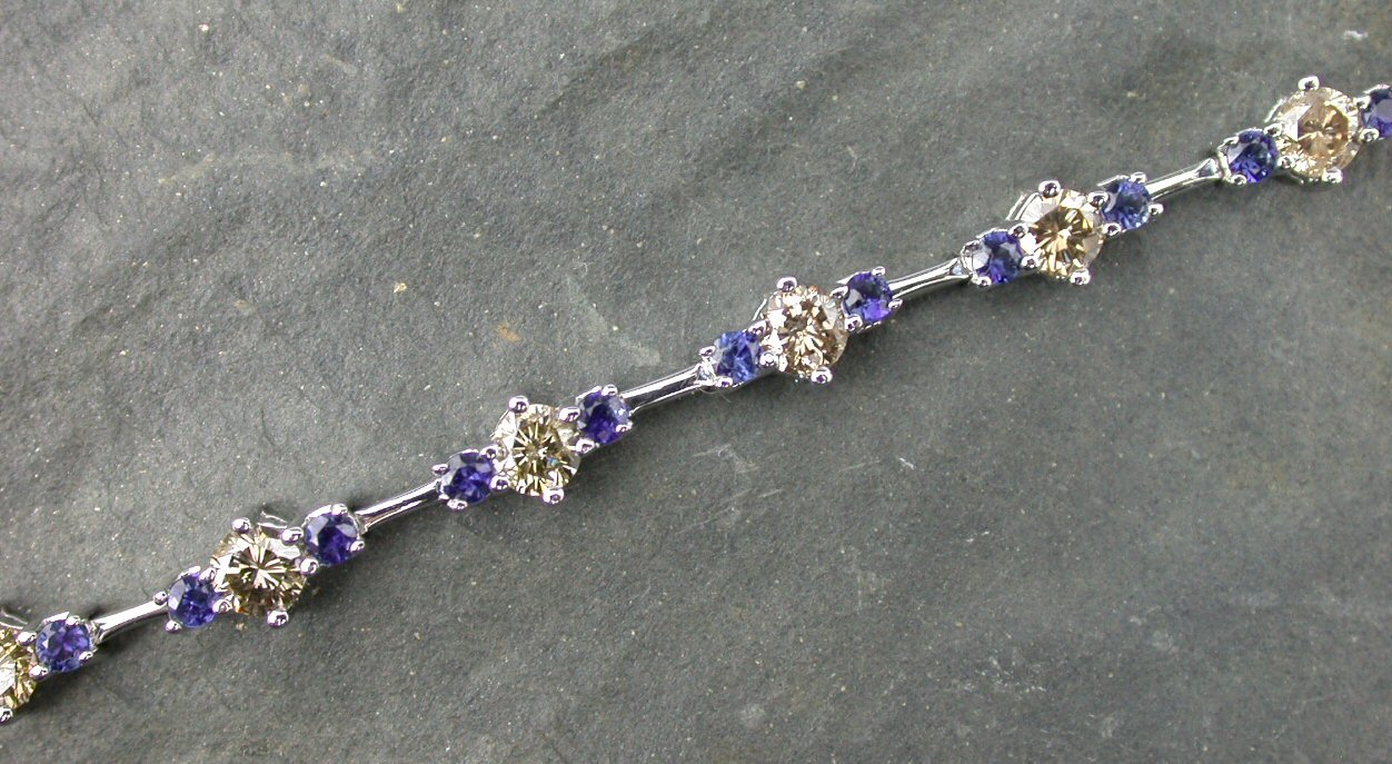 A sapphire and cinnamon diamond set bracelet,