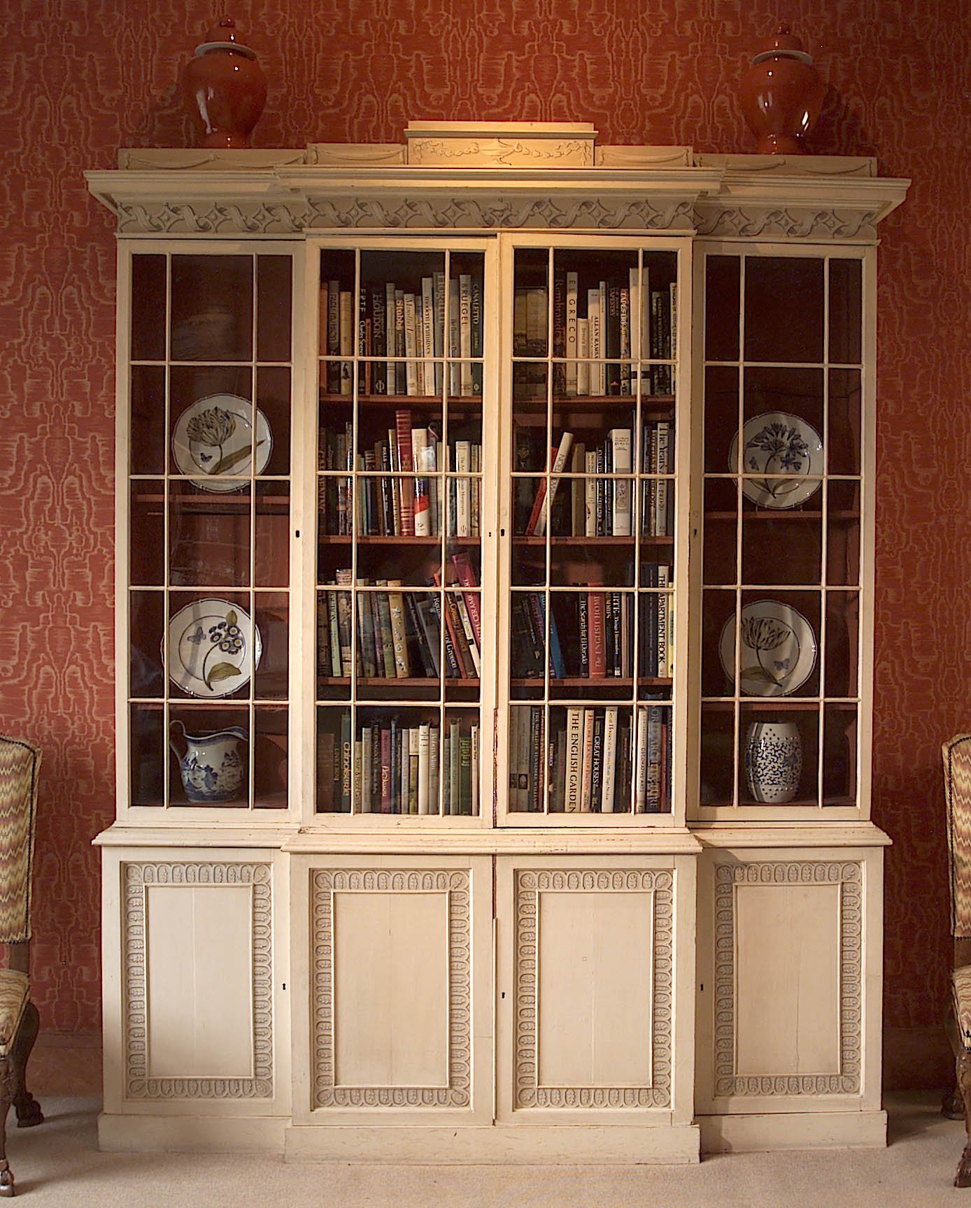 An early 19th century, and later, tromp l'oeil breakfront bookcase