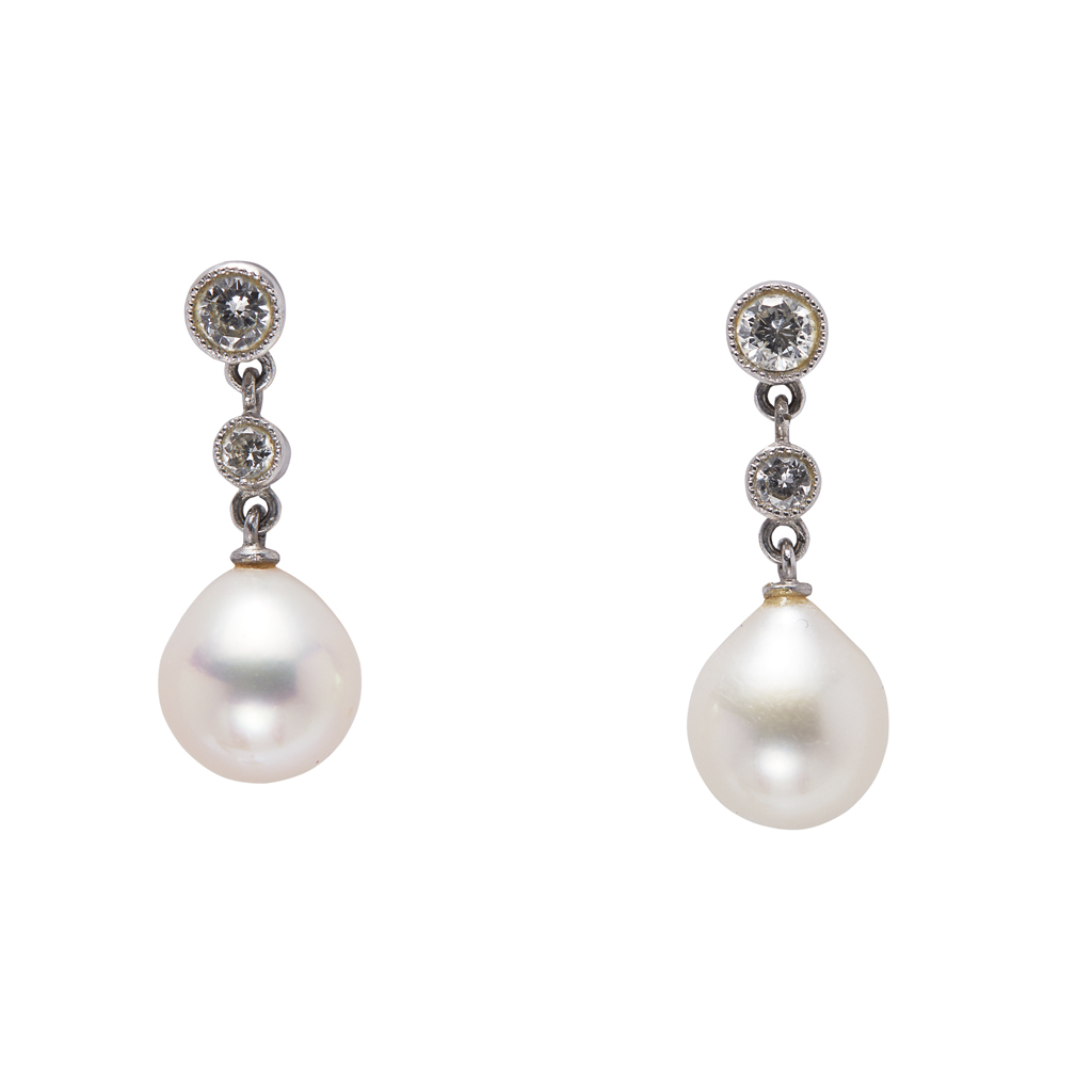 A pair of pearl and diamond set drop earrings