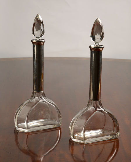 A pair of cut glass perfume bottles