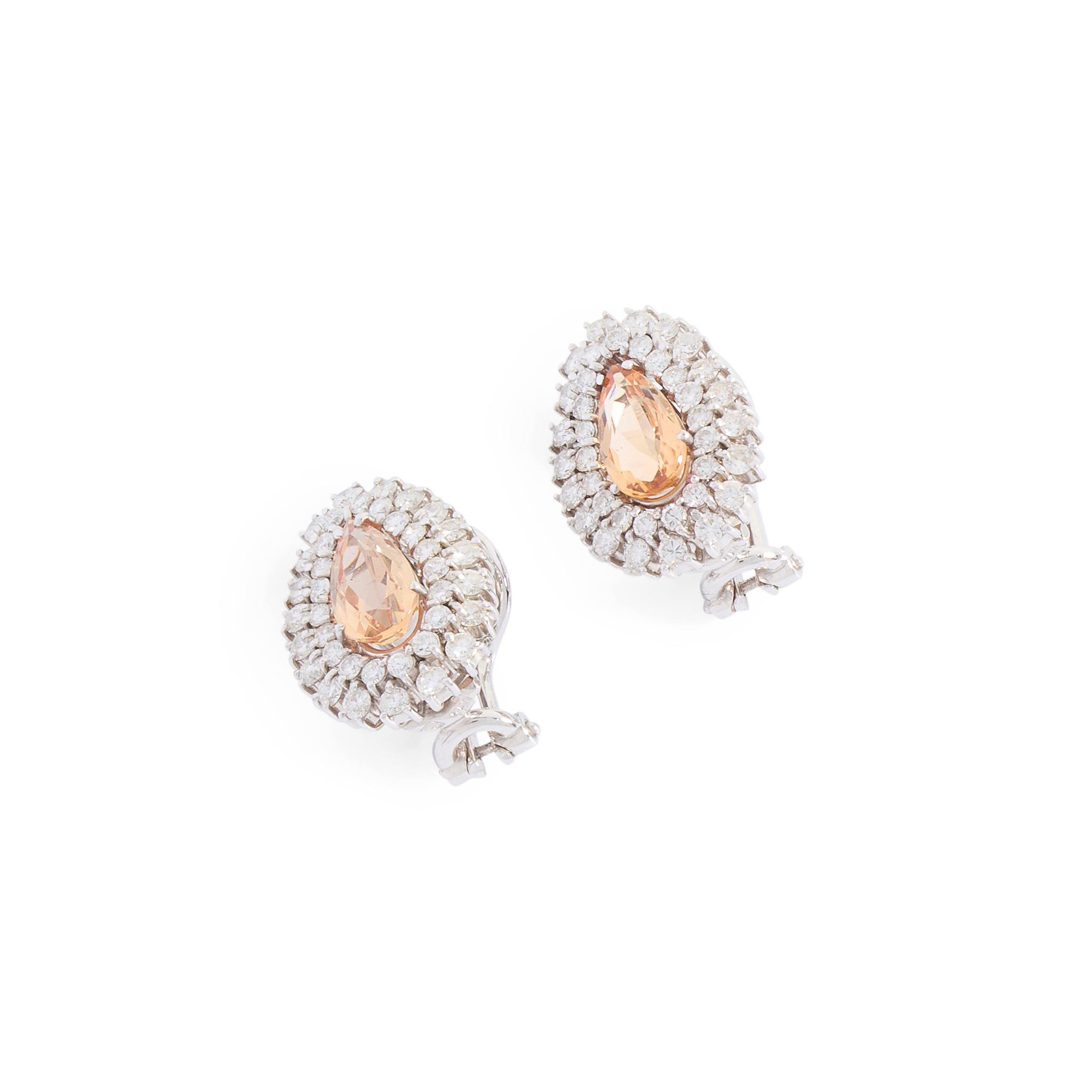 A pair of golden topaz and diamond cluster earrings