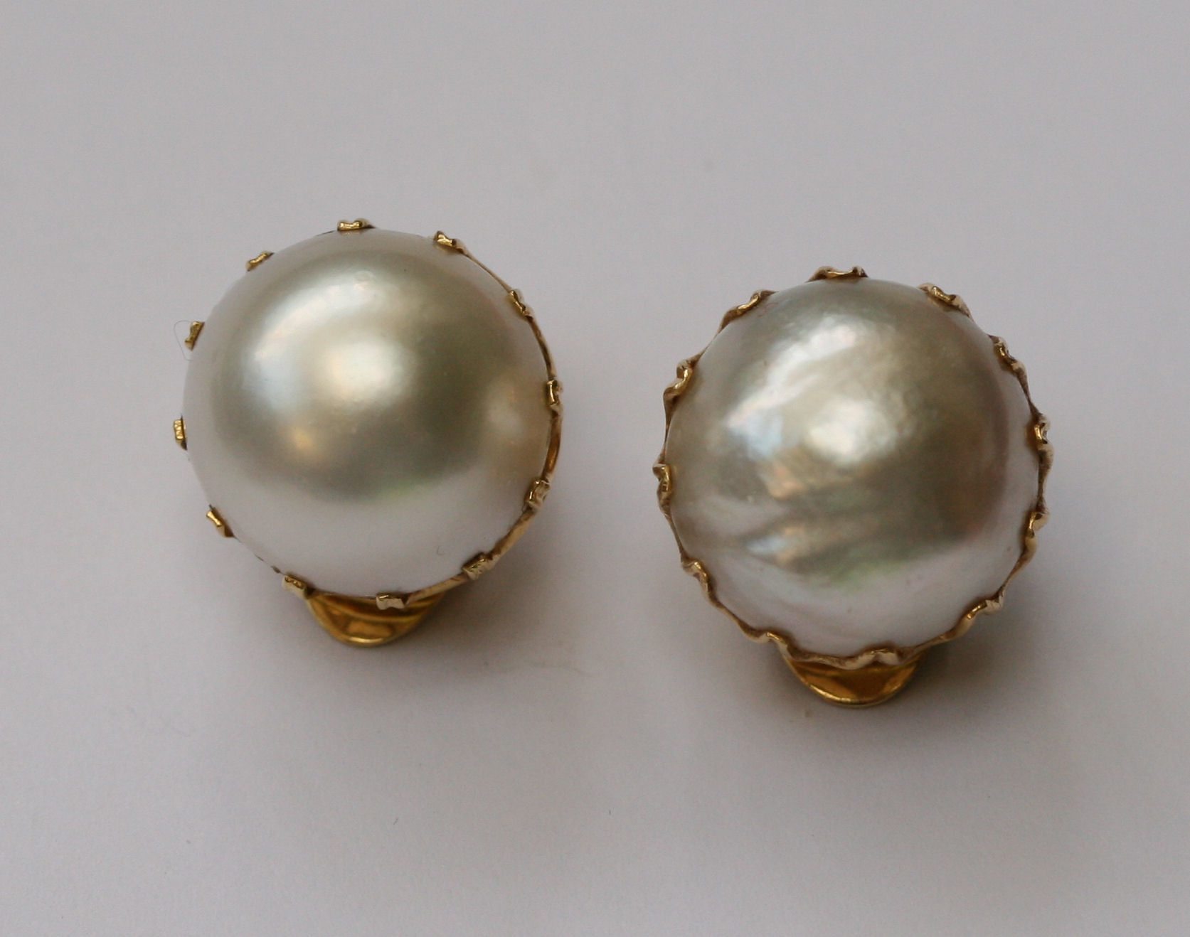 A pair of mabe pearl ear clips