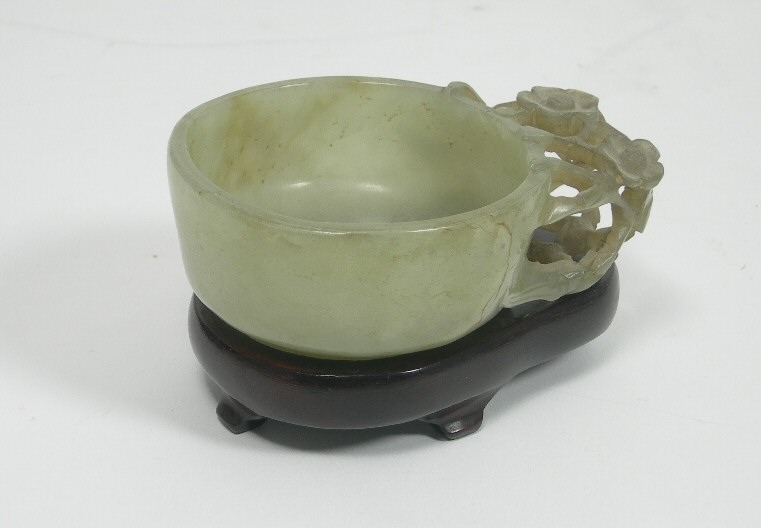 A Chinese pale green jade small circular bowl