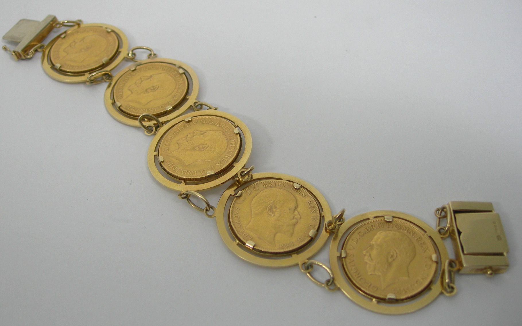 A 9ct gold mounted five sovereign set bracelet,