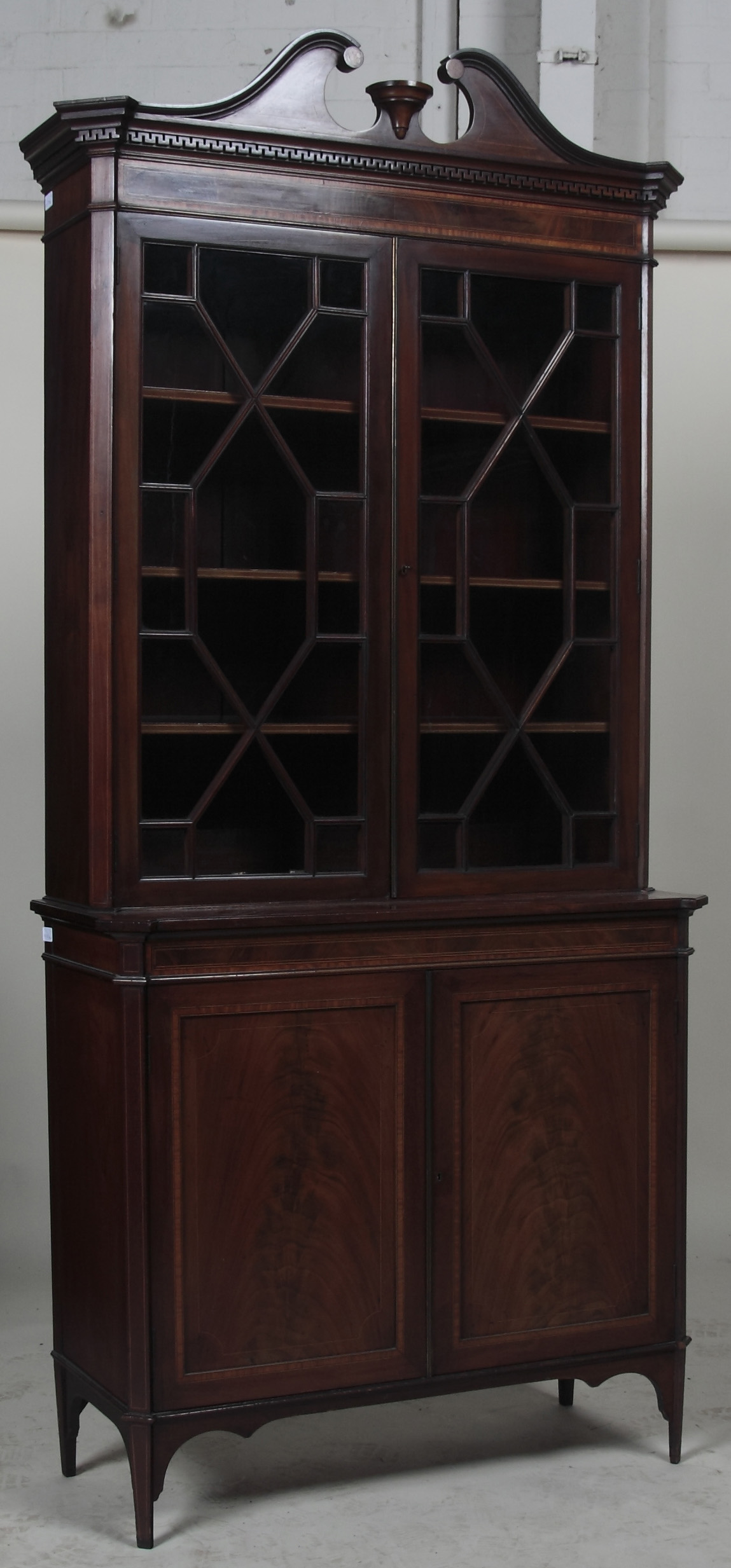 An Edwardian mahogany inlaid bookcase