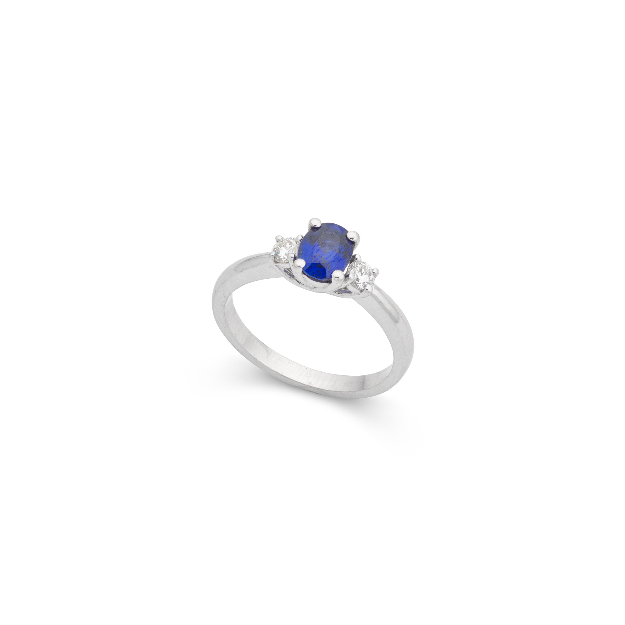 An 18ct white gold sapphire and diamond three-stone ring