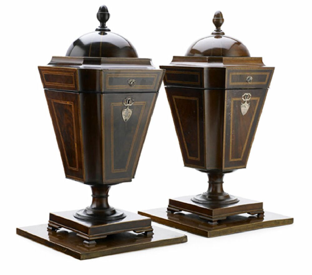 A matched pair of George III mahogany and kingwood crossbanded cutlery urns